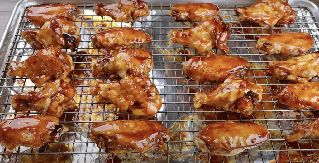 adding 2nd coat bbq sauce to wings